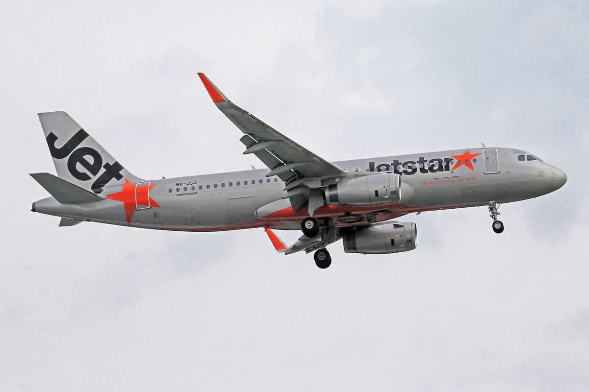 Jetstar Airbus A320 airliner flying in clear cloudy skies