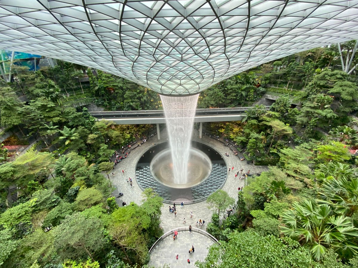 Indoor waterfall and lush garden at Jewel Changi Airport Singapore — airport attraction near Changi terminals