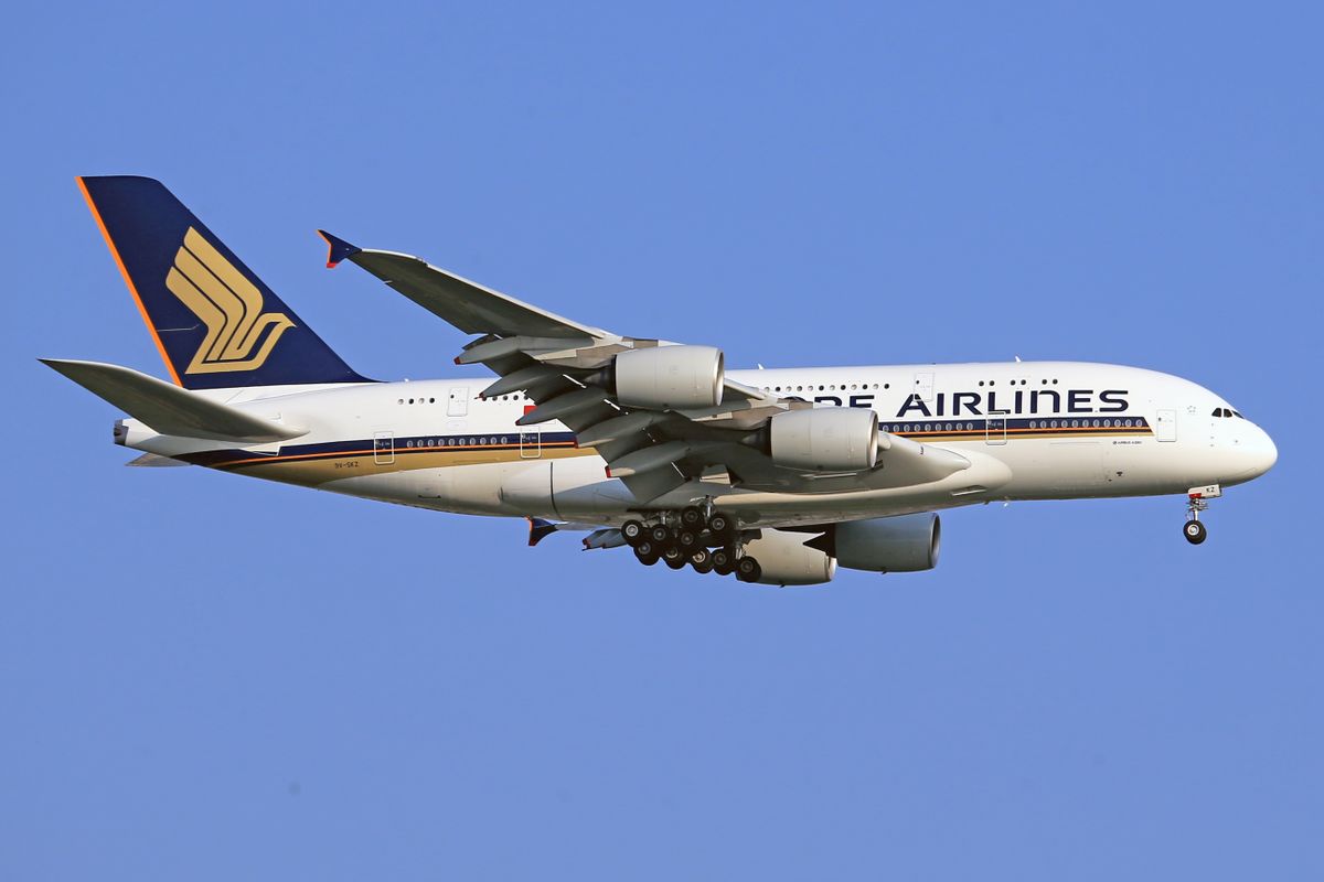 Singapore Airlines Airbus A380 jet flying against a clear blue sky — double-decker aircraft